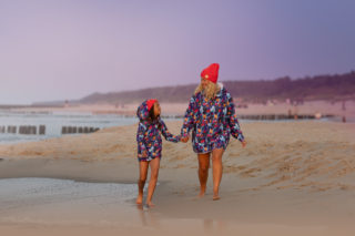 Mum and son walking beach in surf hoodie kangoo oversized hoodies.