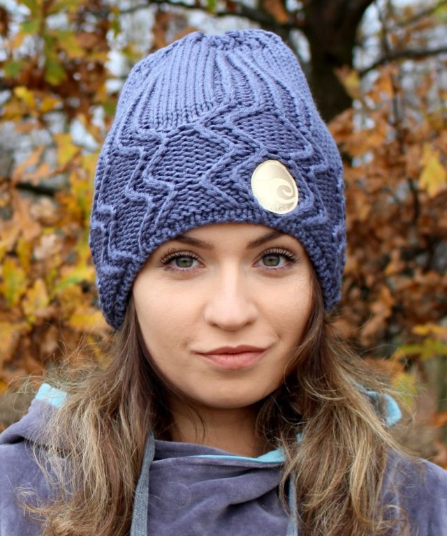 Surf girl wearing Anthracite surf beanie knitted hat in Autumn forest.